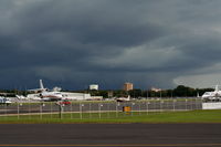  - Orlando Executive Airport with Downtown Orlando and storm in background - by Florida Metal
