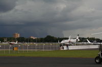  - Stormclouds brewing over Downtown Orlando casting shadow on Orlando Executive Airport - by Florida Metal