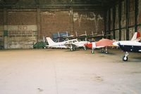  - some aircraft in one of the hangers at barton-uk - by andy baker