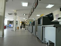  - Interior of depature terminal. No staff to be seen. - by John Grummitt