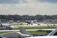  - Line up of departing aircraft on NBAA last day - by Florida Metal