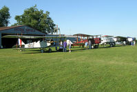  - Antique Airplane lineup of the decade at Antique Airfield near Blakesburg, IA. Curtiss JN-4h Jenny, DeHavilland DH-4, Boeing 40C & Ford 4-AT-B Tri-motor - by BTBFlyboy