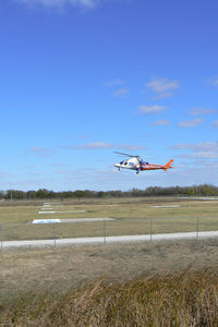  @ Bell Training Facility Heliport - Texas Motor Speedway Heliport - CareFlite N144CF landing during the Boy Scout Camporee - by Zane Adams