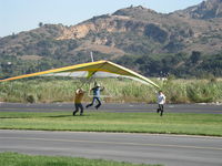  - Repealing the Law of Gravity-Hang Glider launching from level ground-Momentary liftoff with helping push - by Doug Robertson