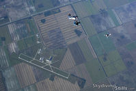  - Skydivers over Clewiston, FL - by Dave G