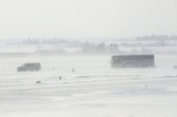  - Something you don't see everyday; safety escorts the U of I football team on taxiway A enroute to the plane. - by Glenn E. Chatfield