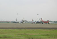  @ Soekarno-Hatta International Airport - Many aircraft in need of repair at Jakarta - by John J. Boling