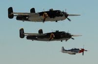  - North Americans over Nellis AFB NV - by J.G. Handelman