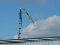  - The windsock has seen better days following yesterdays ~70 MPH wind storm. - by Bob Simmermon