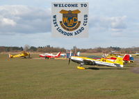 - FUEL PUMPS AT CENTRE WITH AN EXTRA EA 300 IN THE FORGROUND, ONE OF A LARGE NUMBER OF AEROBATIC A/C BASED HERE. - by BIKE PILOT