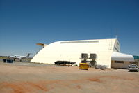  - The hangar of the Royal Flying Doctors Service at Broken Hill airport. The aircraft at the left is King Air B200 VH-MVW of the RFDS. - by Henk van Capelle