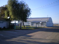  - Hangar at Reedley Muni. - by Jake Carter
