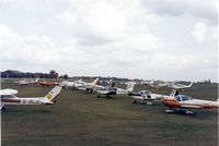  @ EGTI - A view across Leavesden airfield with the competitors gathered for the start of the London to Londonderry Air Race of 1983 - by GeoffW