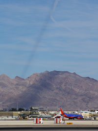  - Contrail shadow being cast on Sunrise Mountain - by Brad Campbell