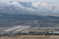  - Reno-Tahoe International's runway 25-7 intersects with parallel runways 16L-34R and 16R-34L in this photo taken from the Virginia Range mountains east of the airport. - by Gary Schenauer