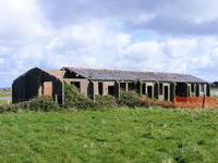  - one of many WWII era buildings around this airfield - by Chris Hall