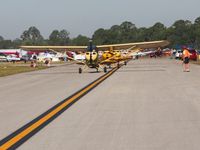  - Three Champs lining up to depart Sun N Fun 2009. - by Bob Simmermon