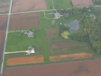  - Unknown N-S farm strip on W300N near Uniondale, IN. There's a nice high-wing mural painted on the hanger door. - by Bob Simmermon