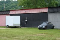  - A little hanger art and a nice old VW at Zanesville Riverside - by Bob Simmermon