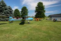  - Tail draggers lined up at the Father's Day fly-in at Beach City, Ohio - by Bob Simmermon