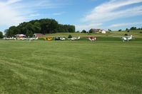  - Looking north across the runway at the planes parked during the Father's Day fly-in. - by Bob Simmermon