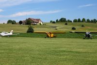  - Looking north across the runway at the planes parked during the Father's Day fly-in. - by Bob Simmermon