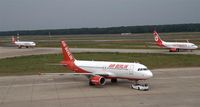  - A bunch of red and white airplanes - by Holger Zengler