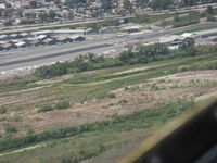  - Downwind Rwy 22 in N406L returning from CNO - by Doug Robertson