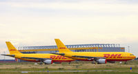  - Two yellow and red victims of the economic crisis at DHL-HUB LEJ - by Holger Zengler