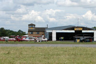  - A view across the runway threshold to Conington Control Tower - by Terry Fletcher