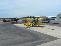  - Planes parked around the gas pump on a nice summer afternoon - by Bob Simmermon