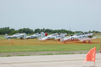  @ 57 - Three AT-6's and a BT-13 at the annual Wing Nuts Flying Circus Fly-in at Tarkio, MO - by BTBFlyboy