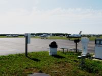  - The ramp in Wautoma, WI. Most of these planes are parked here for EAA AirVenture, then drive over to OSH. This is a very nice airport, the picnic/spotting area in the foreground really stood out to me, looks like a great place to sit and watch planes. Too - by Kreg Anderson