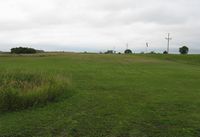  - The grass runway at a private strip just outside of Evansville, MN along County Road 82. - by Kreg Anderson