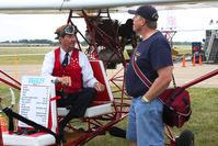  - Breezy inventor Carl Unger giving building tips to Bob Simmermon. - by Bob Simmermon