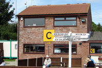  - Signpost outside the Control Tower at Sherburn - although I don't think these exotic destinations will be reached direct from this GA field !!!! - by Terry Fletcher
