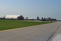  - C-130's lined up at the National Guard wing. - by Bob Simmermon
