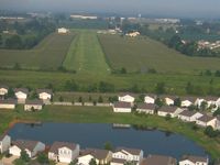  - Final for 27 during the EAA fly-in - by Bob Simmermon