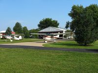  - A pair of Cessna's pulled out for display during the EAA fly-in breakfast - by Bob Simmermon