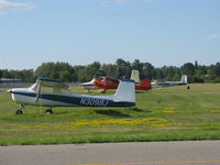  @ Grand Rapids/itasca Co-gordon Newstrom Fld Airport - A grassy area complete with tied down aircraft. Seems...nostalgic :) - by Kreg Anderson