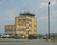  - The control tower is original; the rest of this once quiet airport is surrounded by a panopoly of operators of private jets. - by Daniel L. Berek