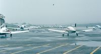  @ Groton-new London Airport - Groton-New London airport apron on a rainy day - by Ingo Warnecke