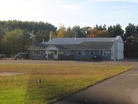  @ Lowell City Airport - The FBO's office.  Note the wood stove smoke.  Nice place to stop. - by Bob Simmermon