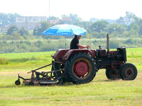  - Mowing the lawn, it's tough job, but somebody 's got to do it..... - by Alex Smit