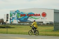  - The Air Canada hangar at YVR with  Vancouver 2010  Olympics  decoration.Note the two spotters on the left - by metricbolt