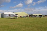  - The Yakovlevs resting at Fishburn Airfield prior to an aerobatics display at Seaham, County Durham in 2005. - by Malcolm Clarke