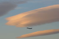  - America West CRJ departing 24L KLAX with some lenticular clouds overhead. - by Mark Kalfas