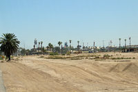  - Mexico as seen from the airport parking lot looking South. - by Marty Kusch