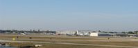  - The view of APF from the hill I was standing on near the end of runway 32. - by Kreg Anderson