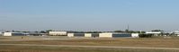  - The view of APF from the hill I was standing on near the end of runway 32. - by Kreg Anderson